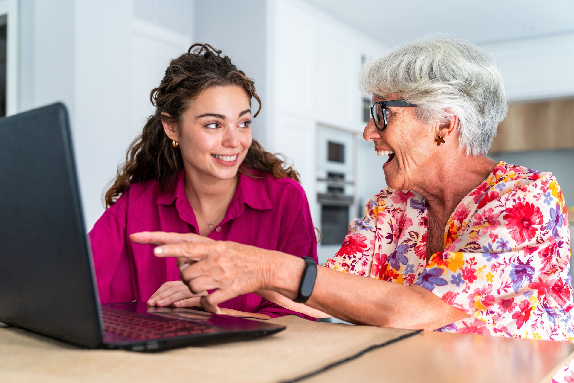 Beautiful grandmother and granddaughter together at home